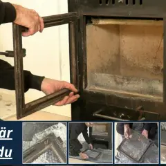 En person tar bort en dörr från en kamin där man ser en sprucken sten i kaminens inre.